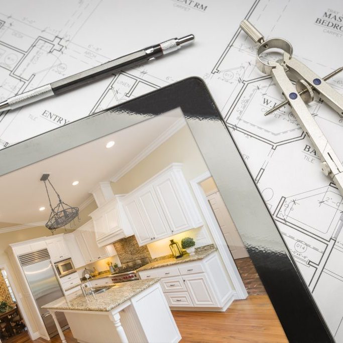 Computer Tablet Showing Finished Kitchen Sitting On House Plans With Pencil and Compass.http://www.feverpitchpro.com/istockphoto/stock-photo-moving-relocating-lightbox.jpg